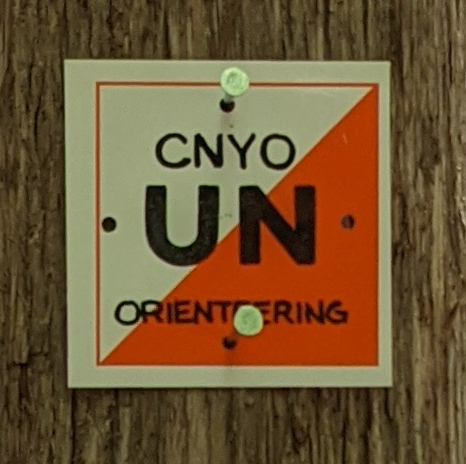 Each trim marker is a 6-by-6-inch square, orange and white, with a two-letter code.